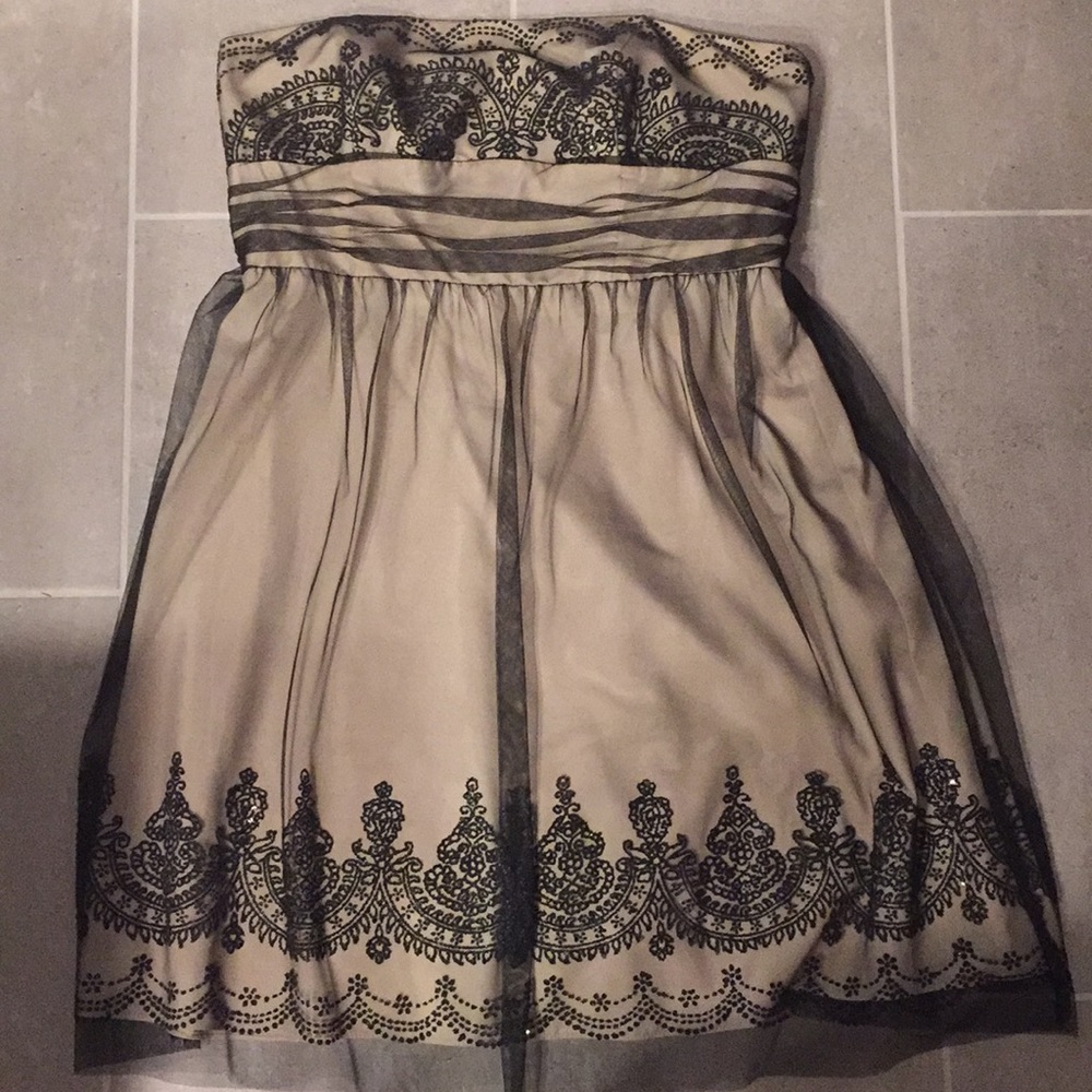 Tan and black strapless dress